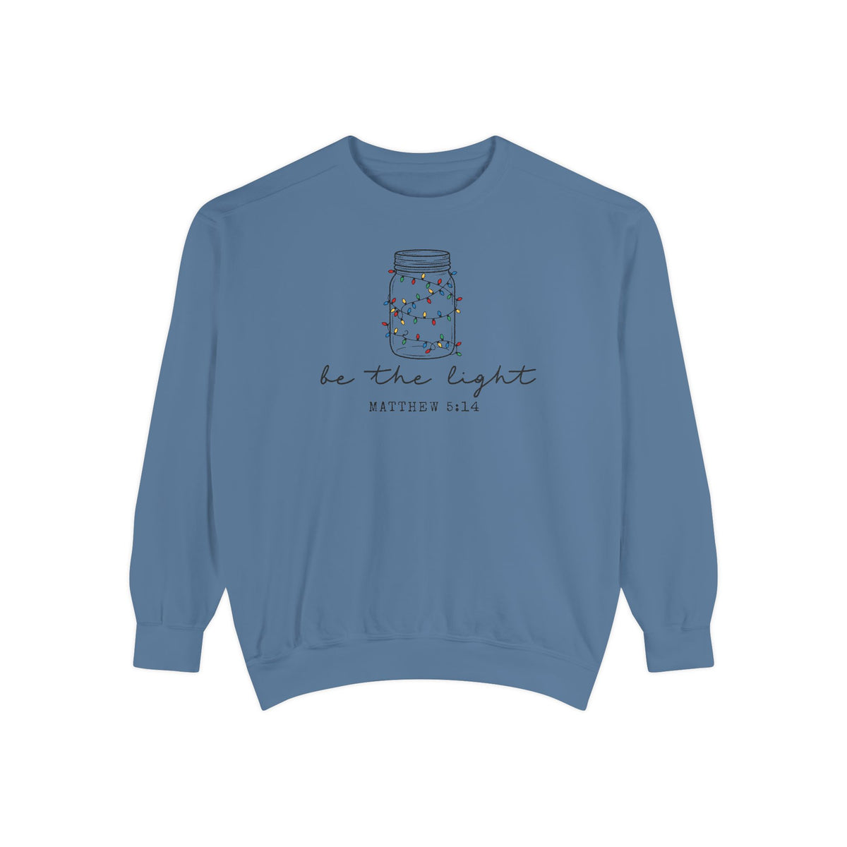 Blue Jean Christian Christmas sweatshirt with a mason jar wrapped in Christmas lights, be the light script and Matthew 5:14.