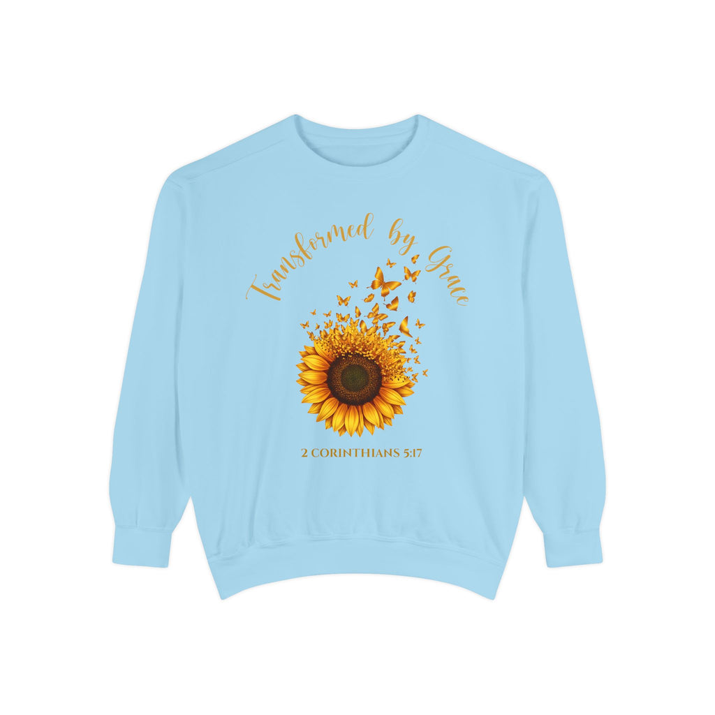 Chambray Christian sweatshirt with a painted sunflower whose petals turn into butterflies, reading Transformed by Grace, 2 Corinthians 5:17