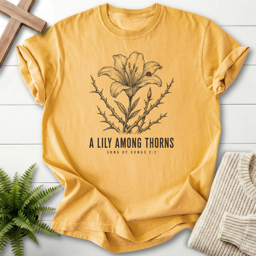 Mustard color option for the A Lily Among Thorns faith-based tee with flower artwork with "A Lily Among Thorns T-Shirt" Songs 2:2.