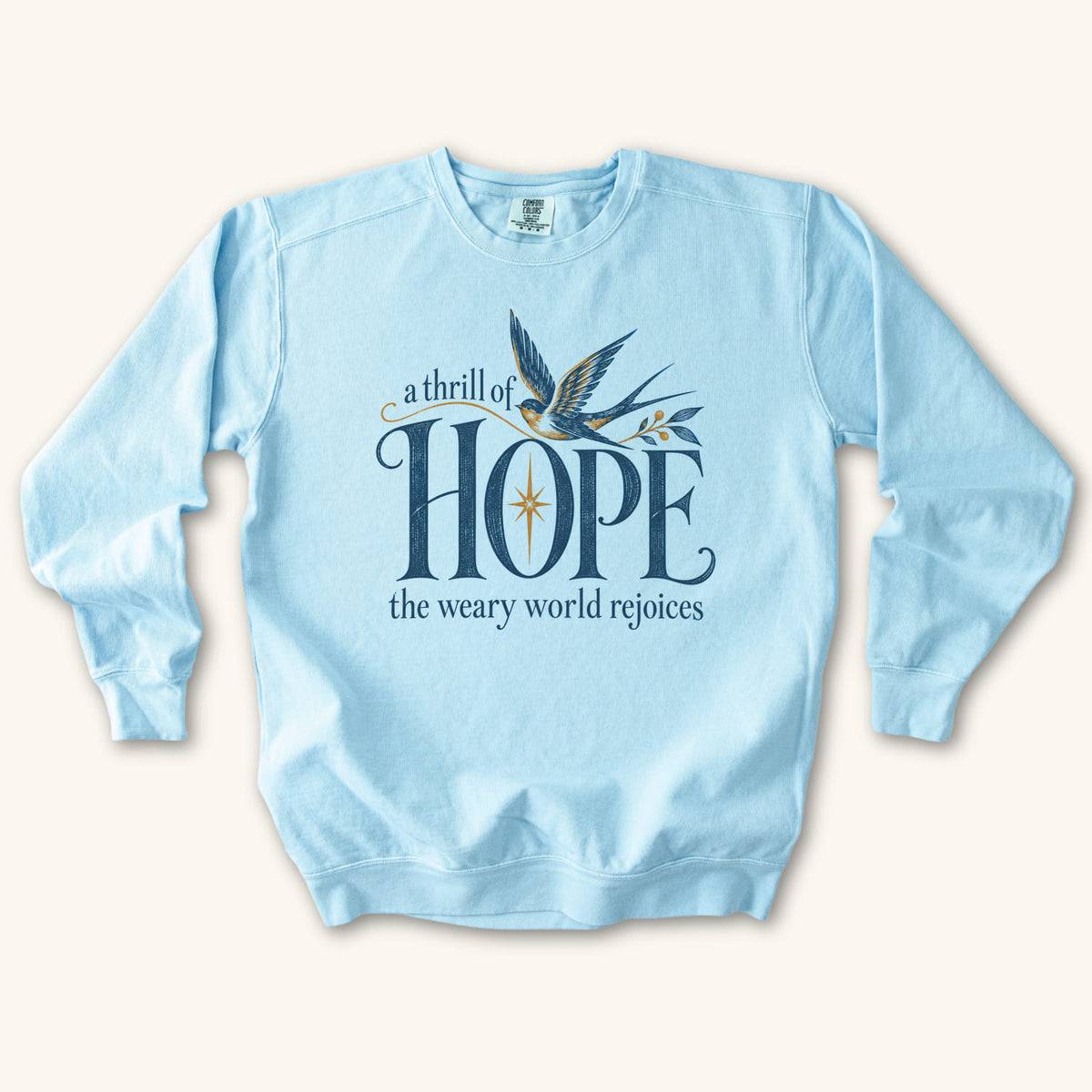Chambray Christian Christmas sweatshirt with A Thrill of Hope, the weary world rejoices lettering, a swallow and a star.