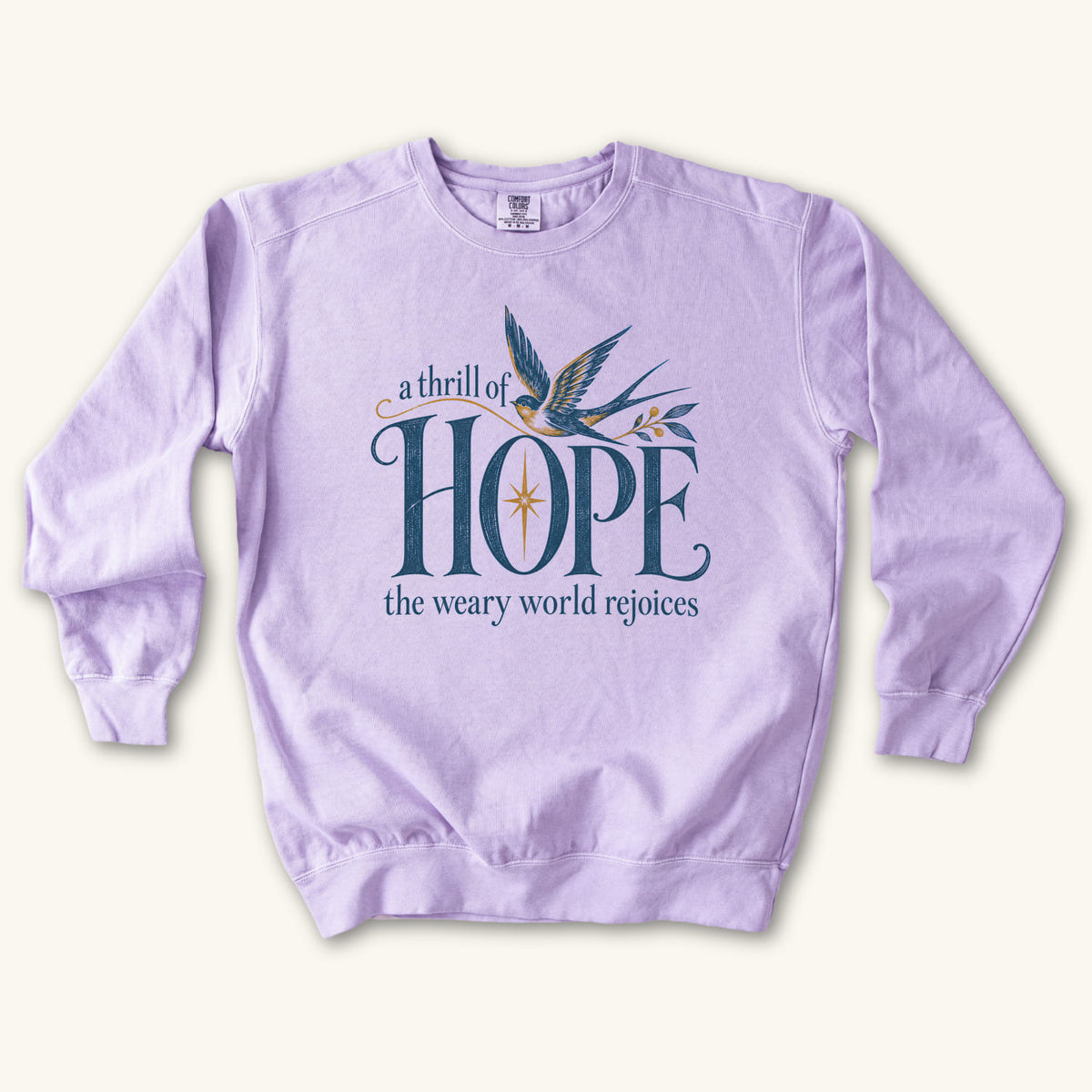 Orchid Christian Christmas sweatshirt with A Thrill of Hope, the weary world rejoices lettering, a swallow and a star.