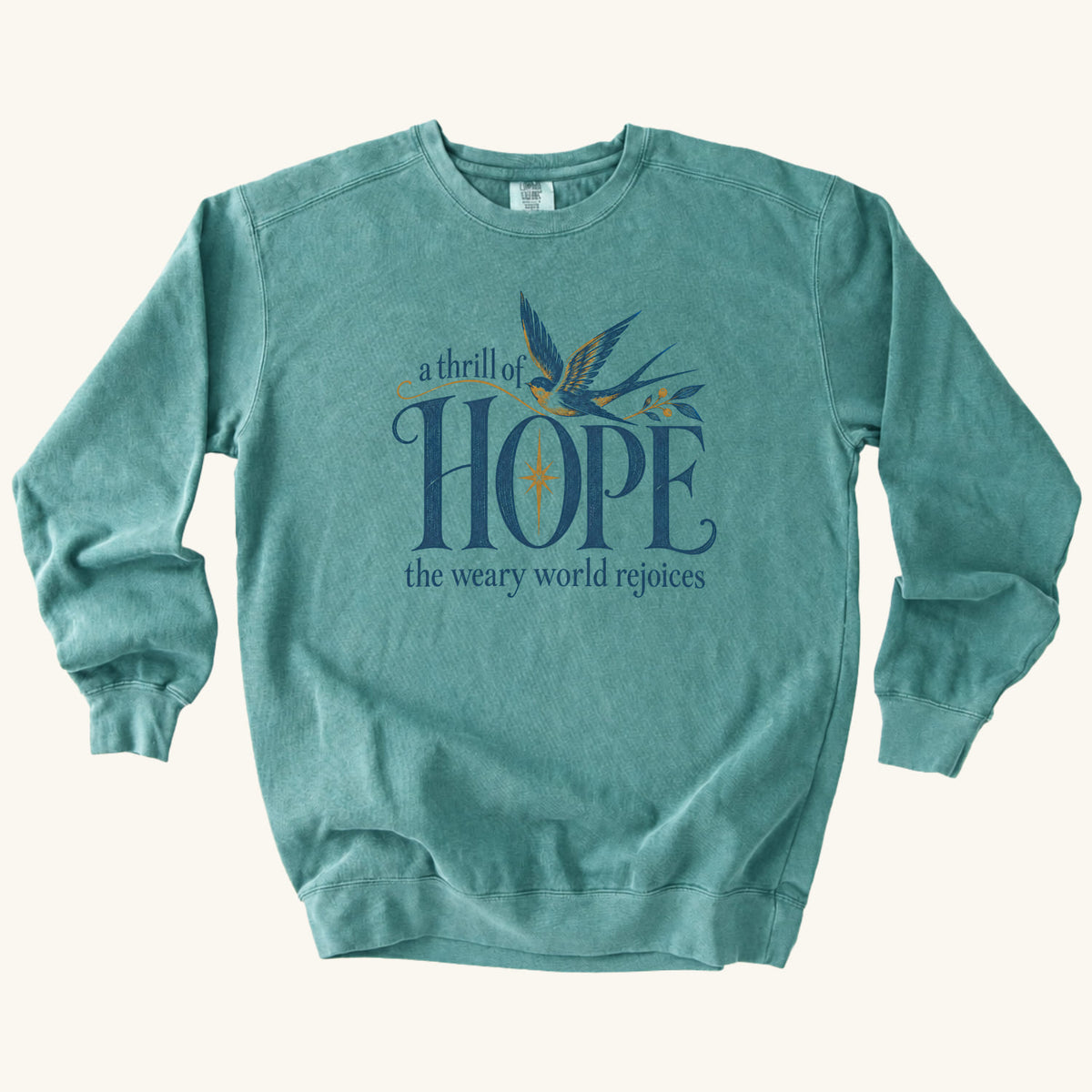 Seafoam Christian Christmas sweatshirt with A Thrill of Hope, the weary world rejoices lettering, a swallow and a star.