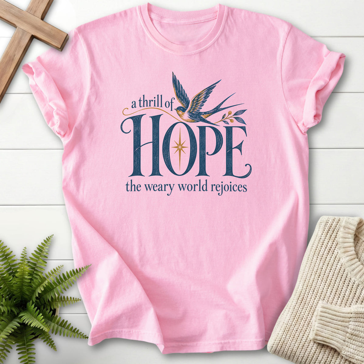 Flatlay of a Blossom Comfort Colors 1717 women's Christian tee with "A Thrill of Hope T-Shirt" design.