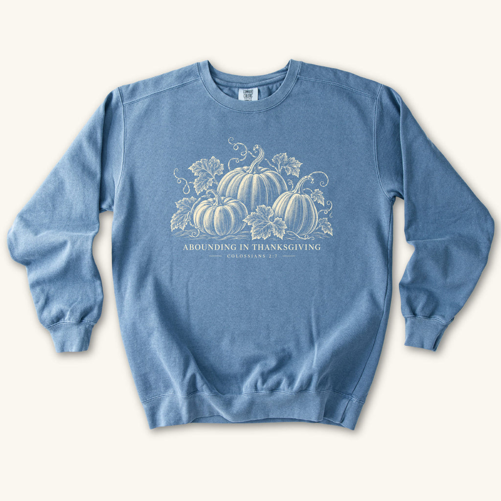 Blue Jean Abounding IN Thanksgiving sweatshirt flat lay mockup, Colossians 2:7 Christian apparel for women