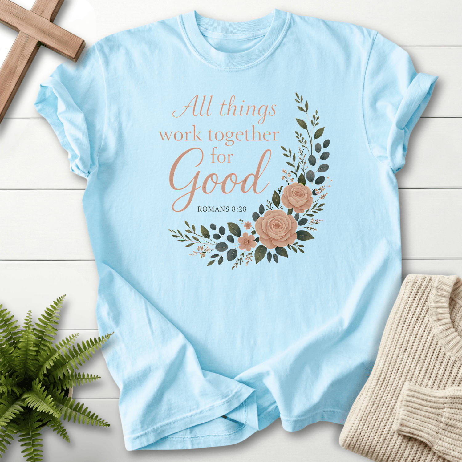Chambray Christian t-shirt for women with a floral wreath and Romans 8:28 lettering, inspired by Romans 8:28.