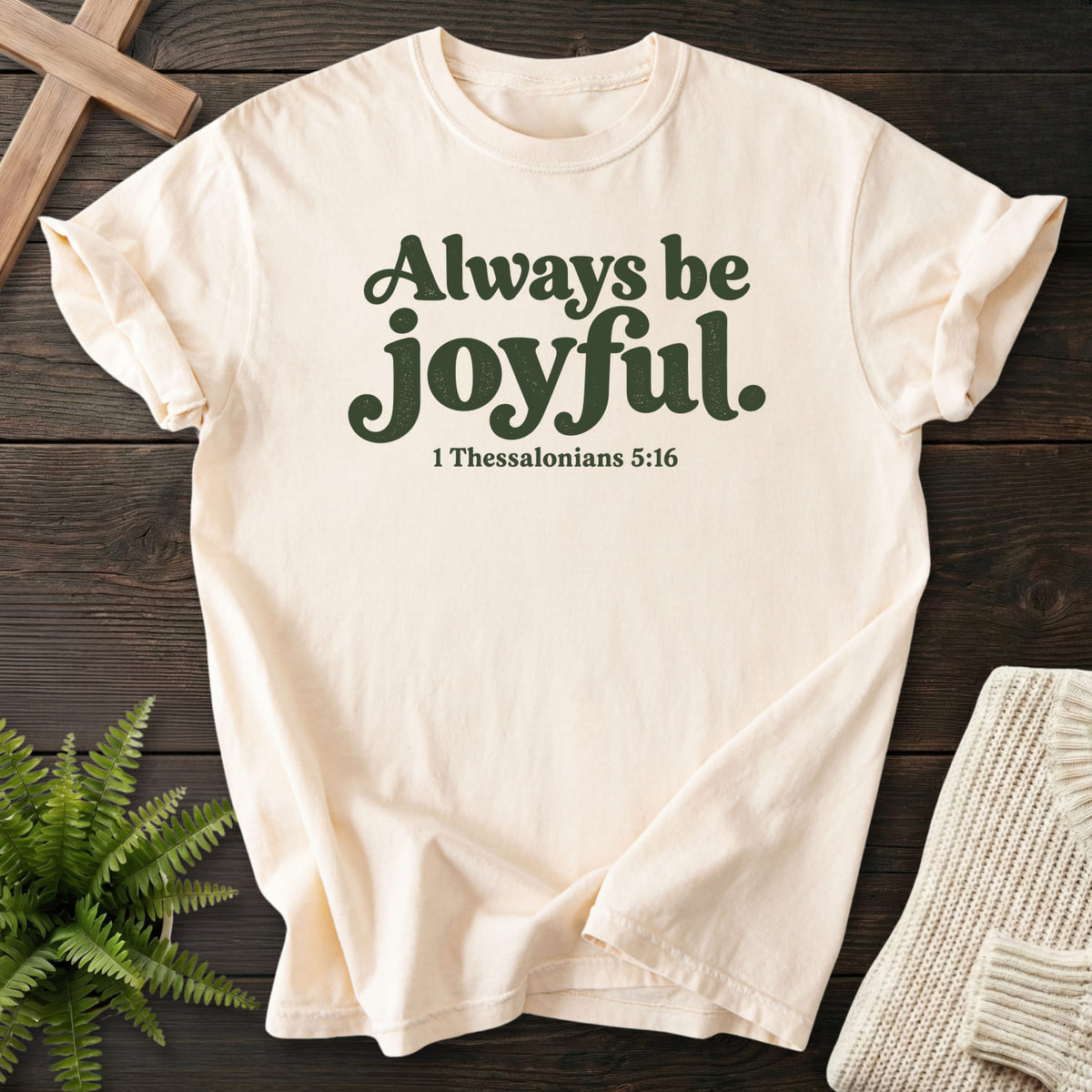 Flatlay of an Ivory Comfort Colors 1717 garment-dyed Christian tee with "Always Be Joyful T-Shirt" 1 Thessalonians 5:16.