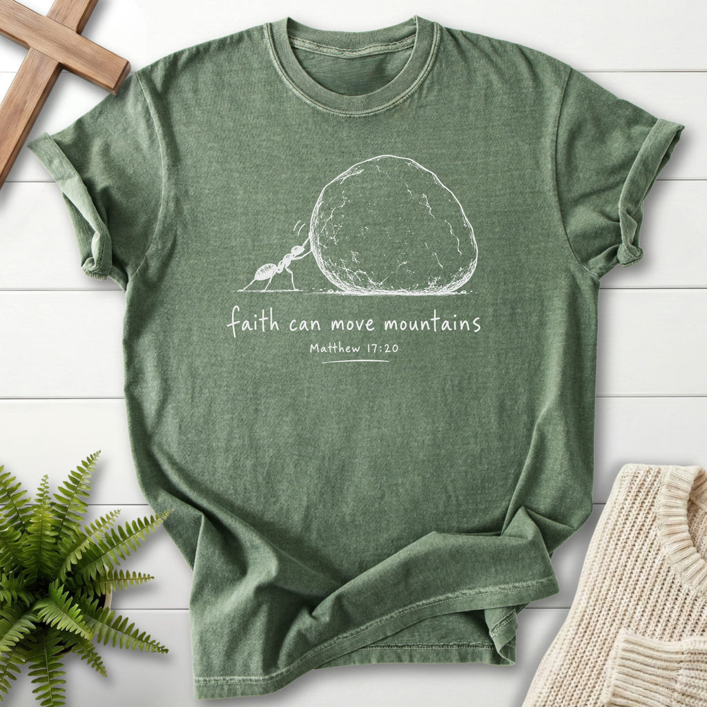 Flatlay of a Moss Scripture shirt with "Ant and Boulder Faith T-Shirt" Matthew 17:20.