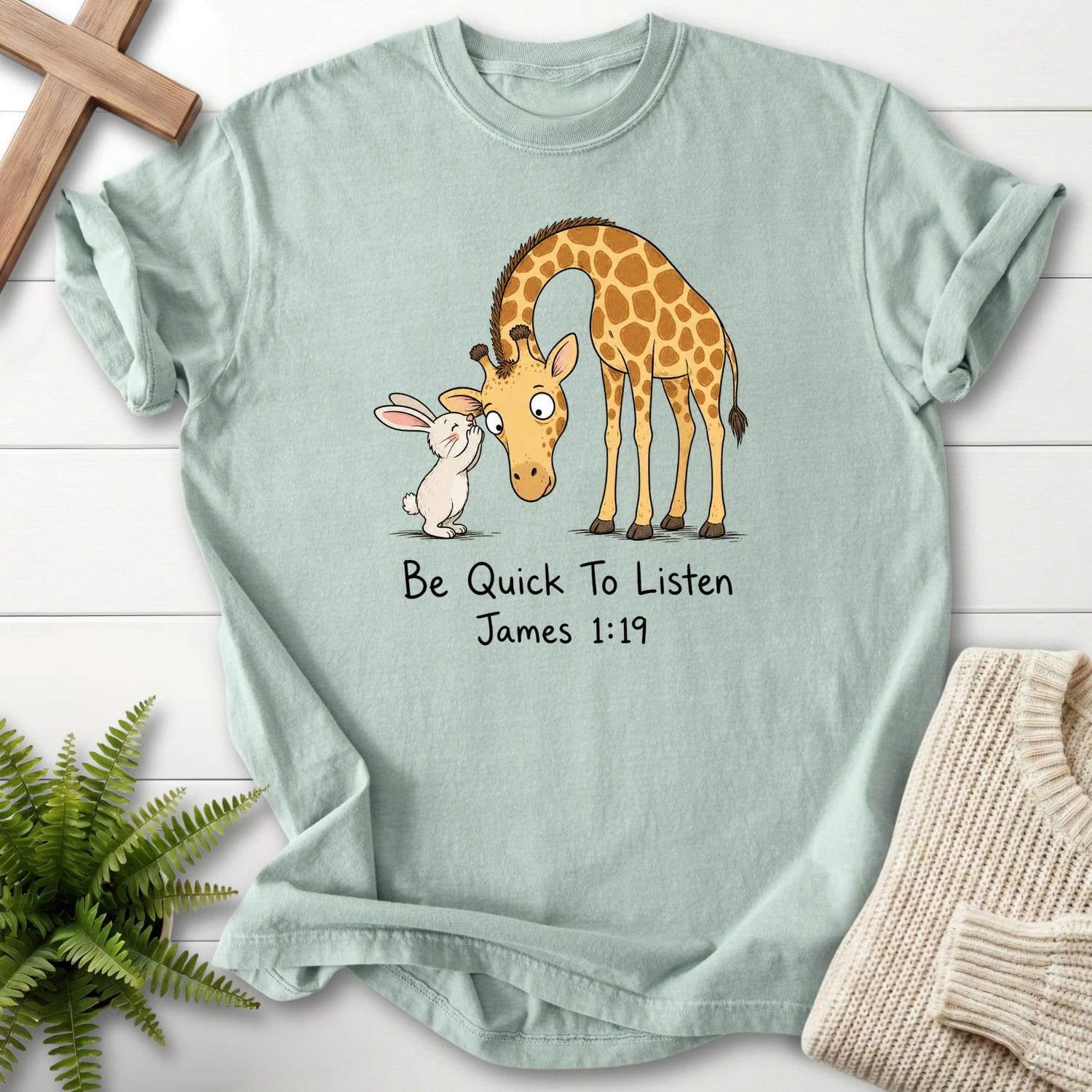 Flat lay of a Bay Bible verse tee featuring "Be Quick To Listen James 1:19 T-Shirt" James 1:19.