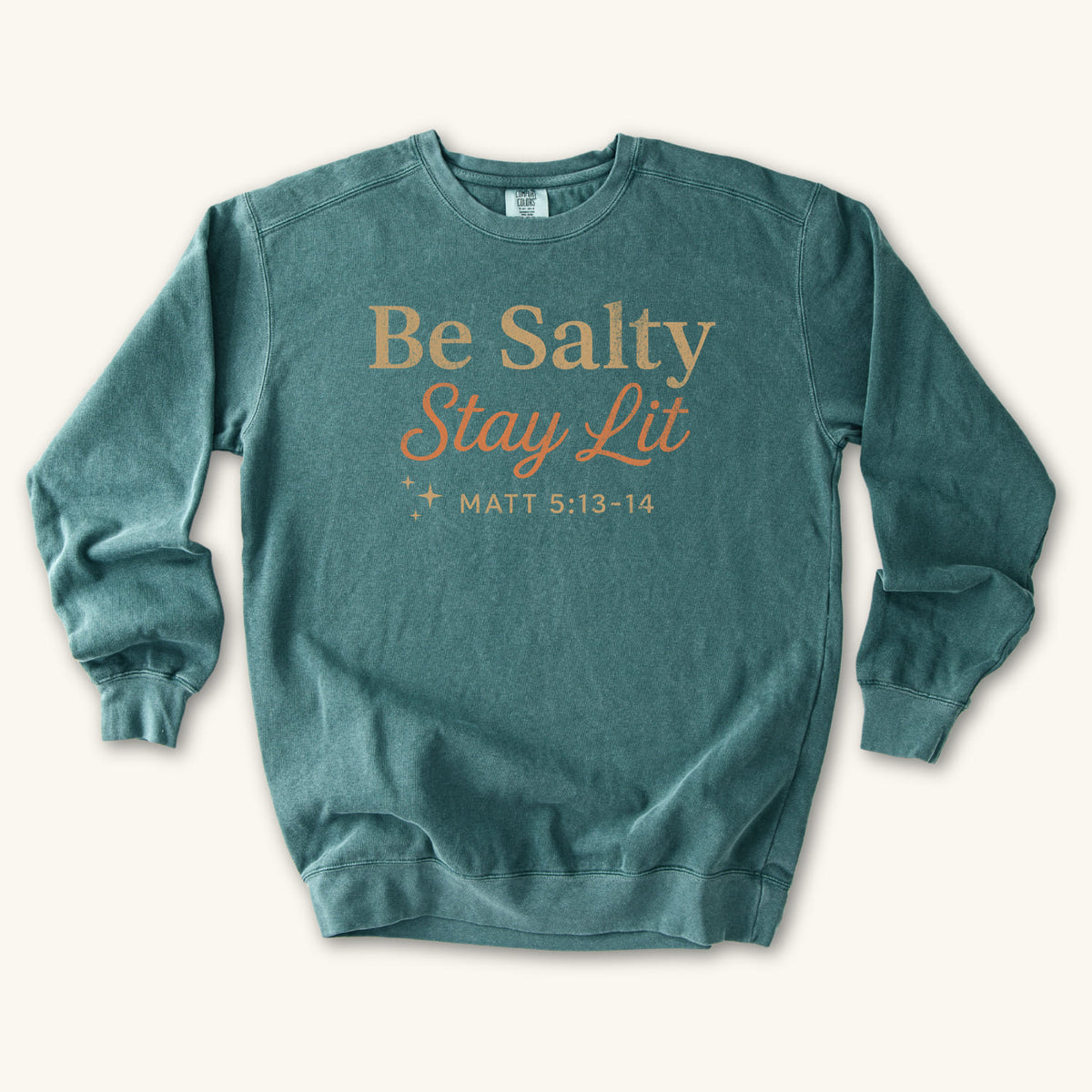 Blue Spruce Christian sweatshirt reading Be Salty Stay Lit in serif and script lettering with sparkles, Matthew 5:13-14