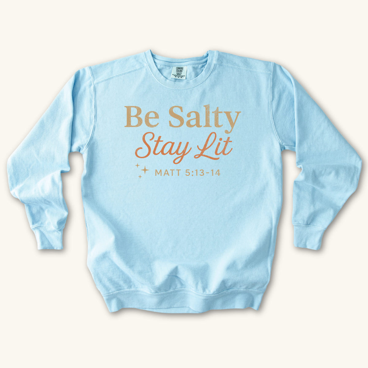 Chambray Christian sweatshirt reading Be Salty Stay Lit in serif and script lettering with sparkles, Matthew 5:13-14