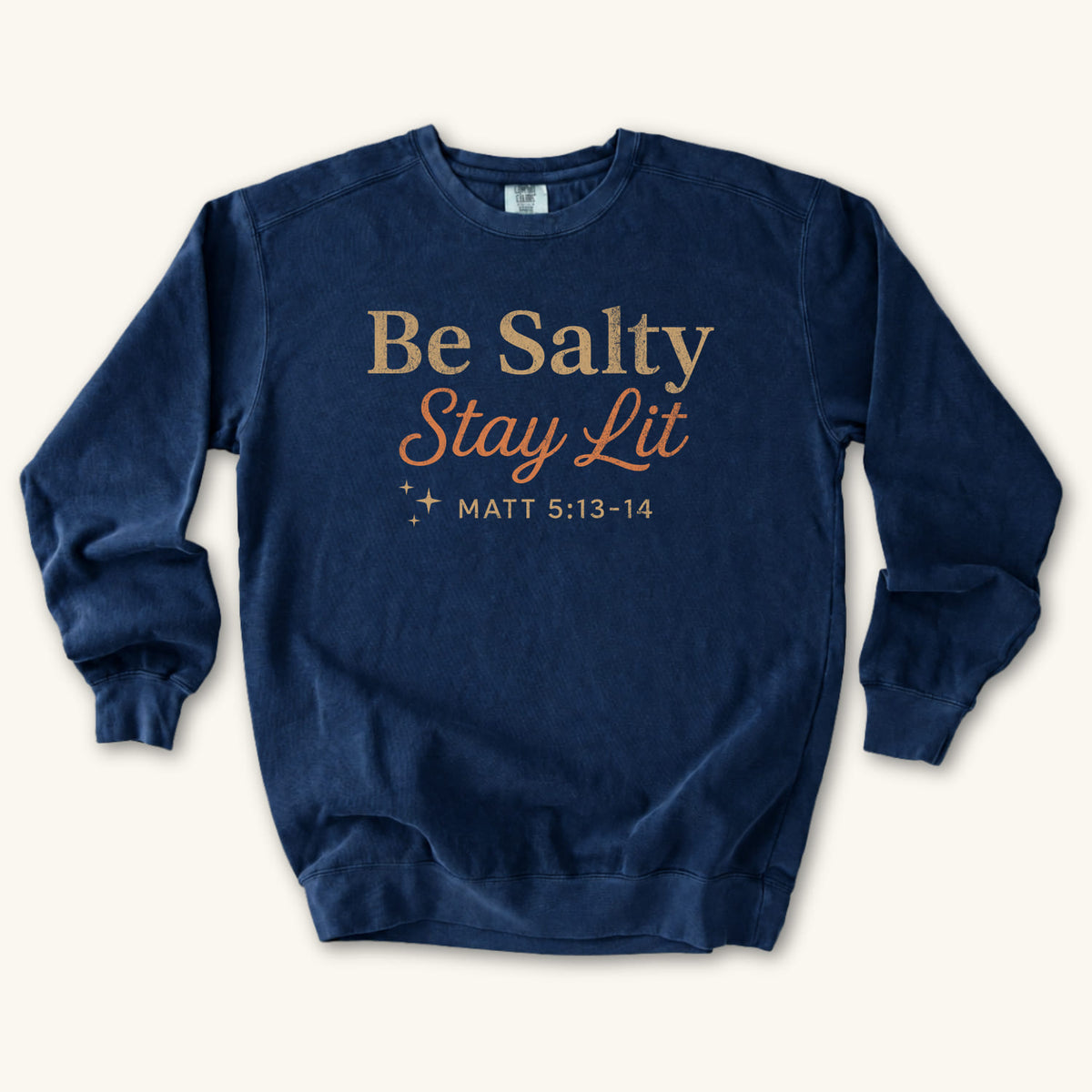 True Navy Christian sweatshirt reading Be Salty Stay Lit in serif and script lettering with sparkles, Matthew 5:13-14