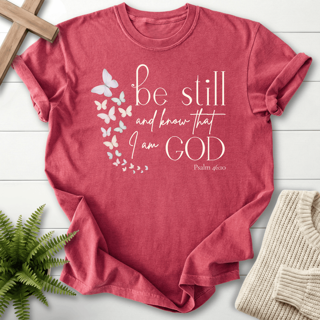 Crimson Christian t-shirt for women with butterfly scripture artwork and 'Be Still and Know That I Am God', She Wears Faith, inspired by Psalm 46:10.