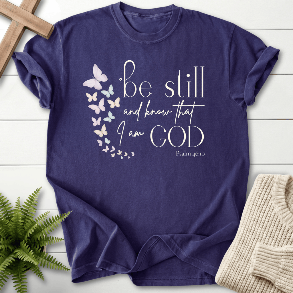 Grape Christian t-shirt for women with a watercolor butterfly cascade and 'Be Still and Know', inspired by Psalm 46:10.