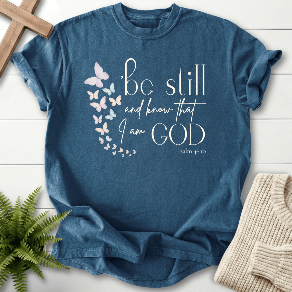 Midnight Christian t-shirt for women with a soft butterfly trail and 'Be Still and Know That I Am God', inspired by Psalm 46:10.