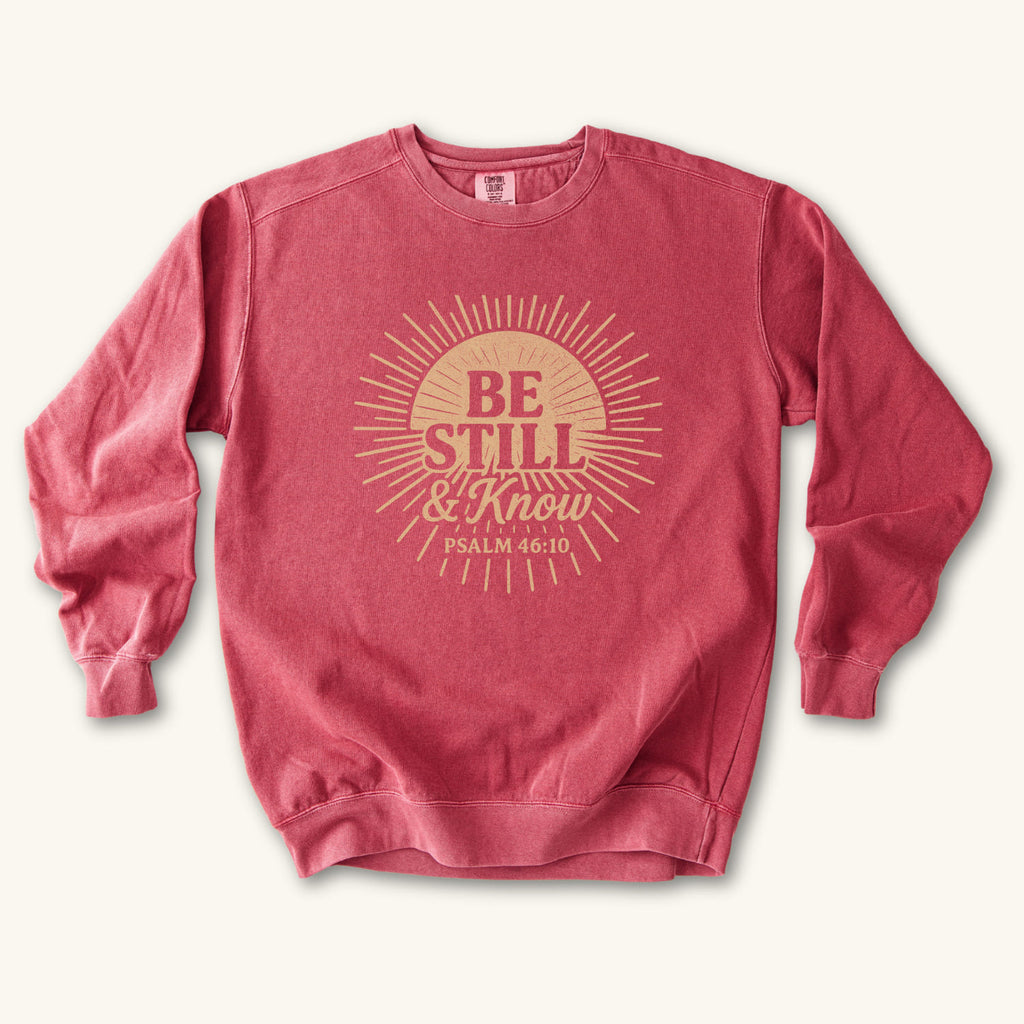 Crimson Be Still & Know Sunburst sweatshirt flat lay mockup, Psalm 46:10 Christian apparel for women