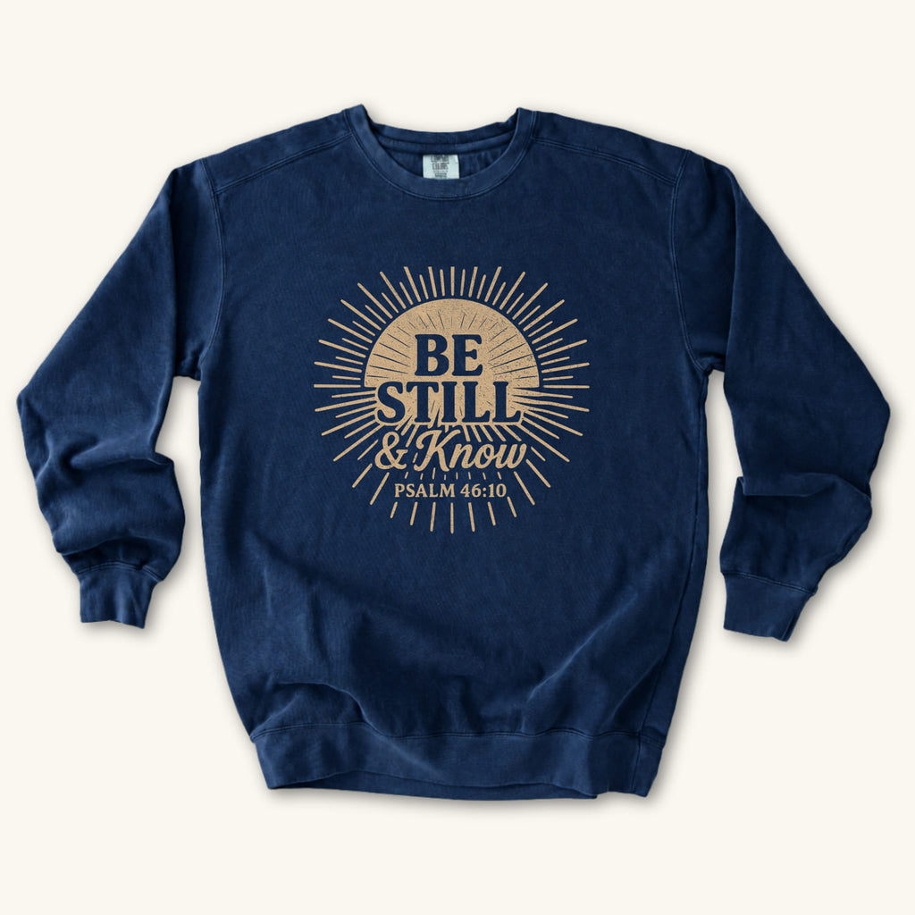 True Navy Be Still & Know Sunburst sweatshirt flat lay mockup, Psalm 46:10 Christian apparel for women