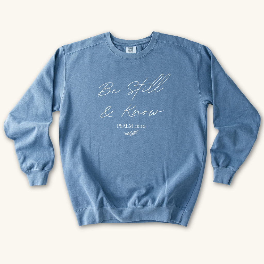 Blue Jean Be Still & Know sweatshirt flat lay mockup, Psalm 46:10 Christian apparel for women