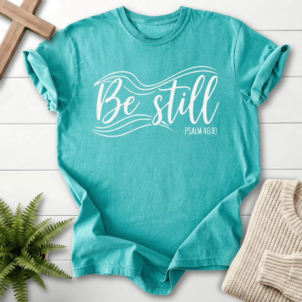 Seafoam Christian t-shirt for women with flowing 'Be Still' script, inspired by Psalm 46:10.