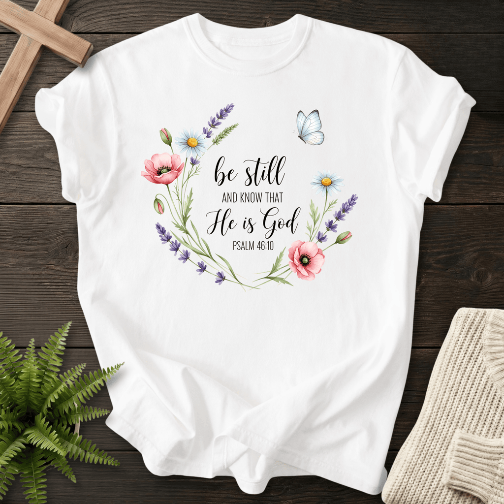 White Christian t-shirt for women with a watercolor wildflower wreath, inspired by Psalm 46:10.