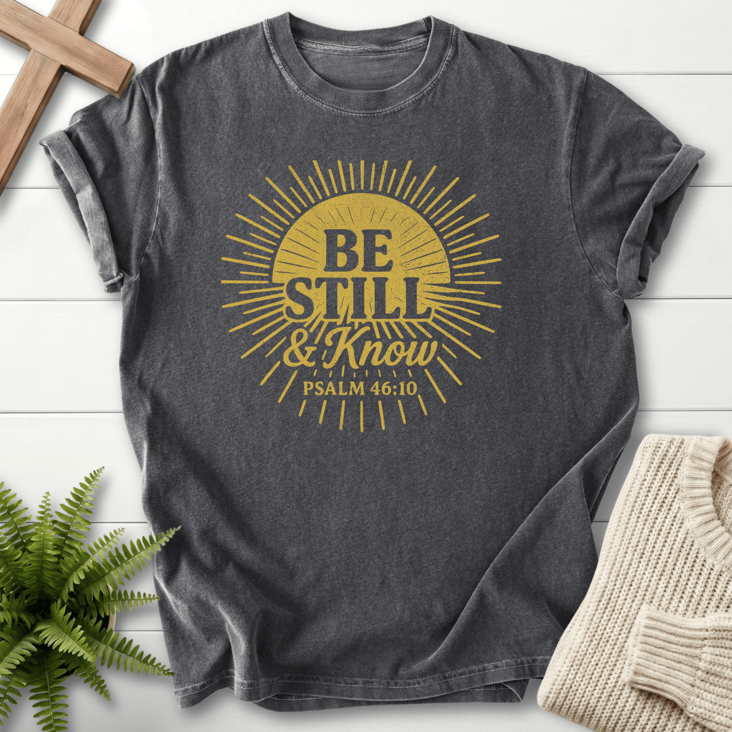 Pepper Christian t-shirt for women with a vintage sunburst design and 'Be Still and Know', inspired by Psalm 46:10.