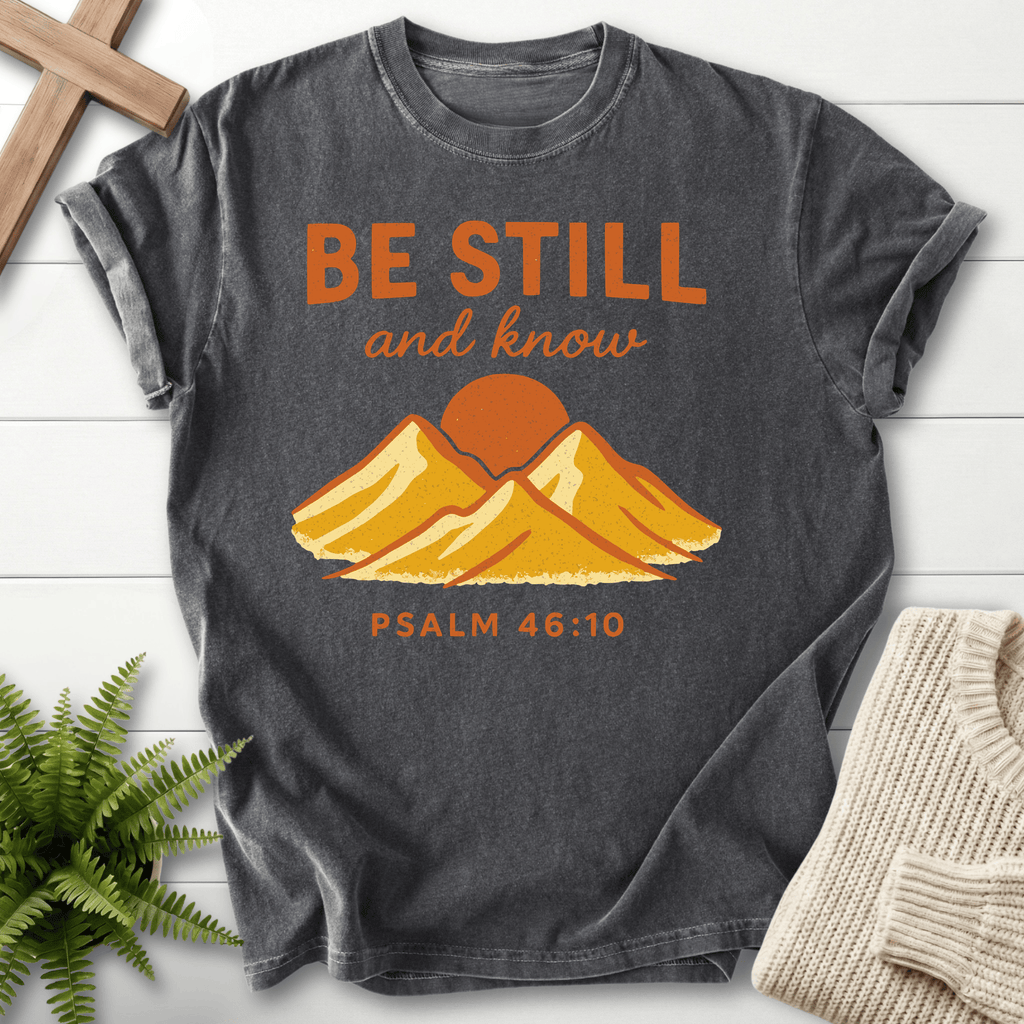 Pepper Christian t-shirt for women with a bold mountain landscape and retro 'Be Still and Know', inspired by Psalm 46:10.