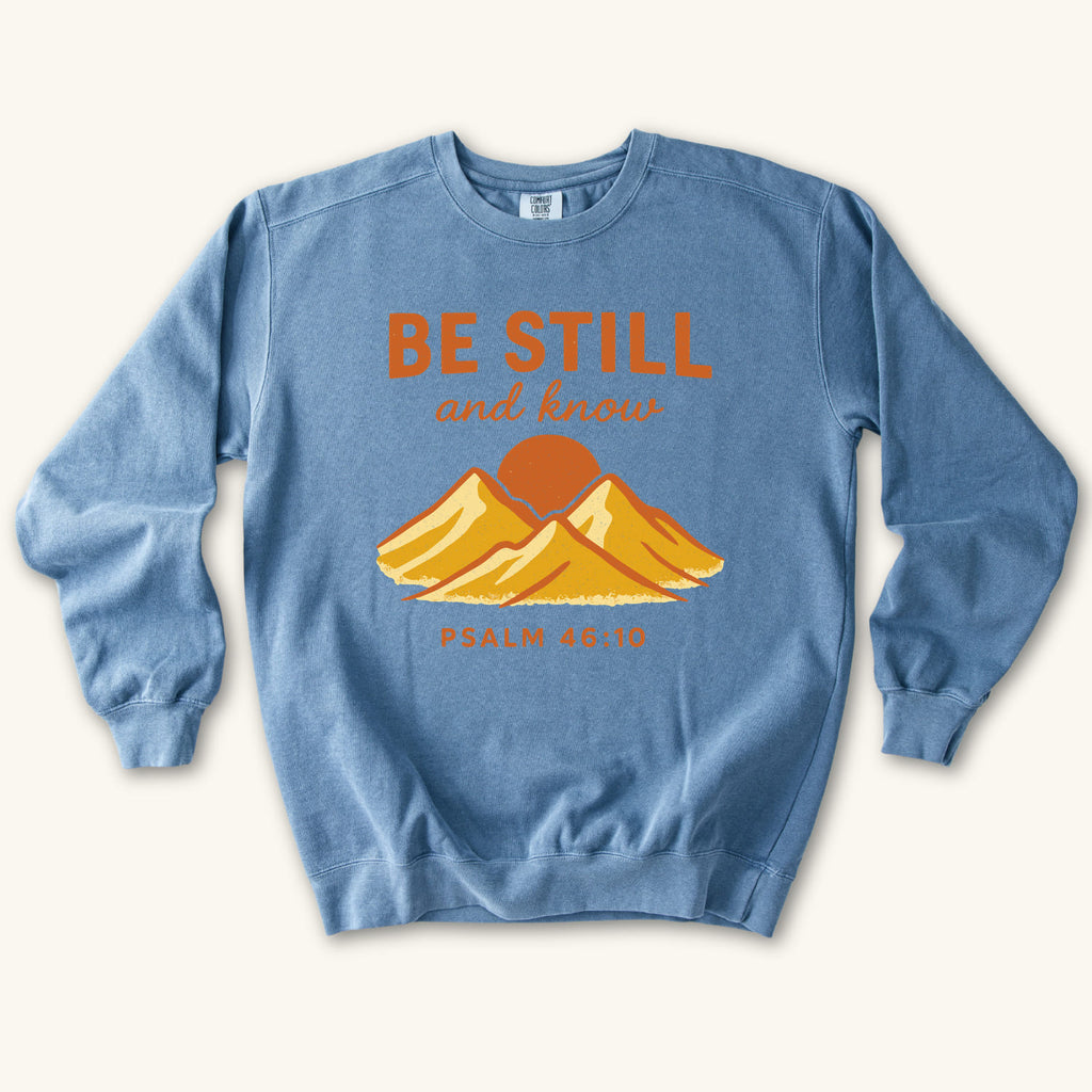Blue Jean Be Still Mountain Sunrise sweatshirt flat lay mockup, Psalm 46:10 Christian apparel for women