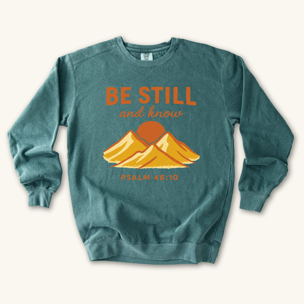 Blue Spruce Be Still Mountain Sunrise sweatshirt flat lay mockup, Psalm 46:10 Christian apparel for women