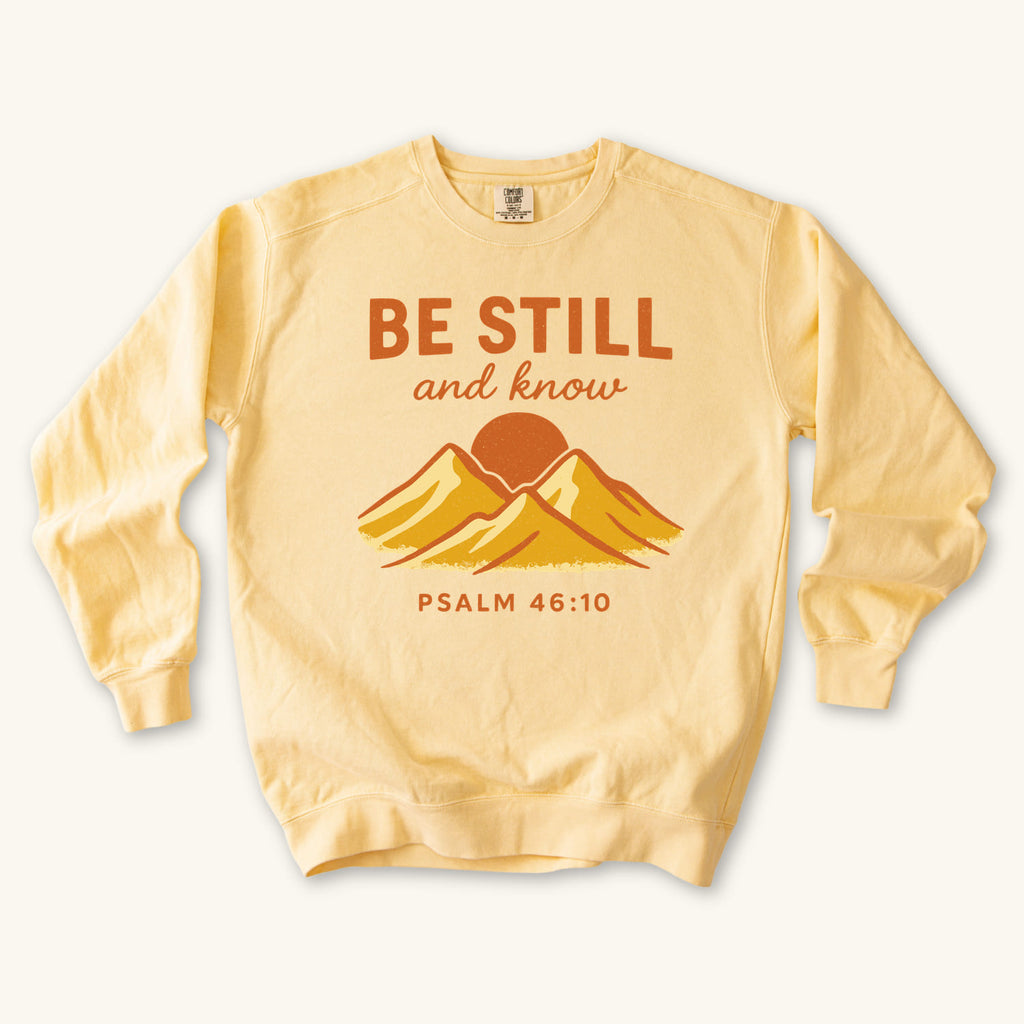 Butter Be Still Mountain Sunrise sweatshirt flat lay mockup, Psalm 46:10 Christian apparel for women