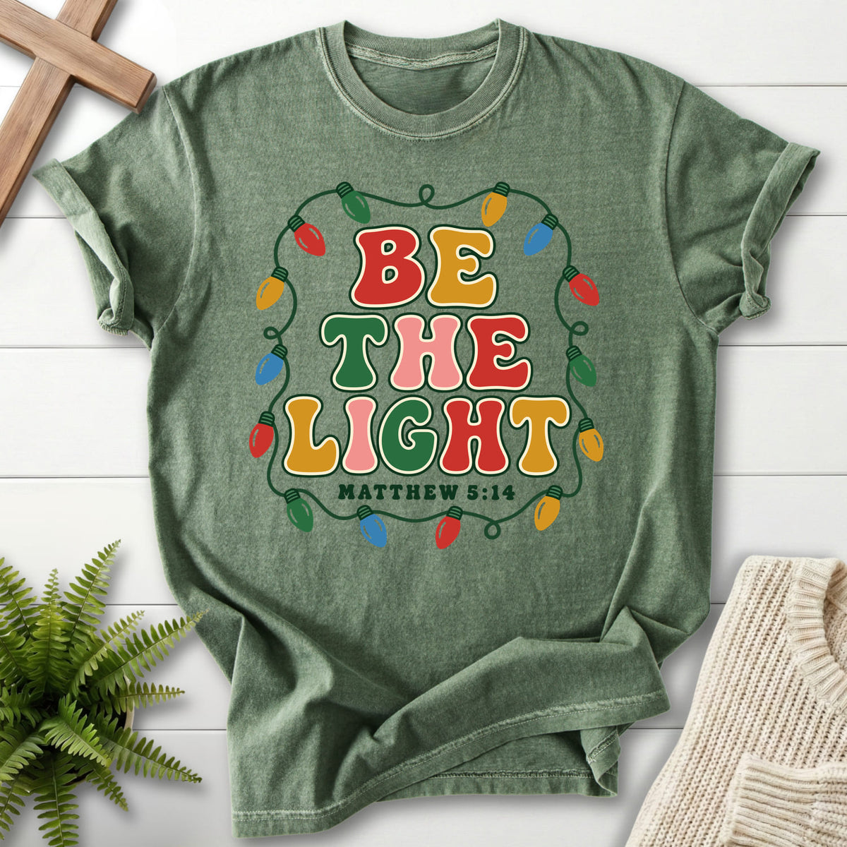 Moss Be the Light Christmas Lights T-shirt flat lay mockup, Matthew 5:14 Christian apparel for women