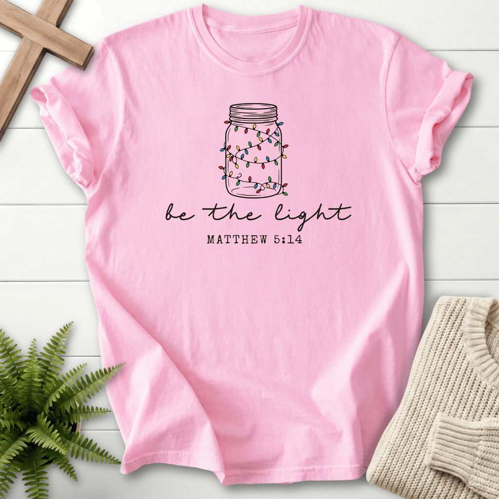 Blossom Christian t-shirt for women with a mason jar filled with Christmas lights and 'Be the Light', inspired by Matthew 5:14.