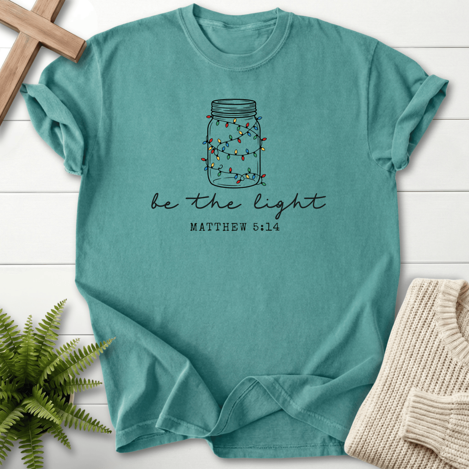 Chalky Mint Christian t-shirt for women with mason jar Christmas lights and 'Be the Light', inspired by Matthew 5:14.