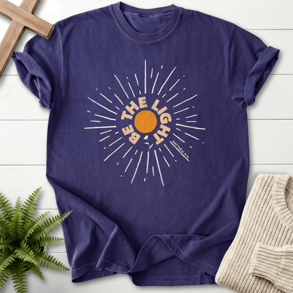 Grape Christian t-shirt for women with a vintage sunburst and Matthew 5:14 in arc lettering and 'Be the Light'.
