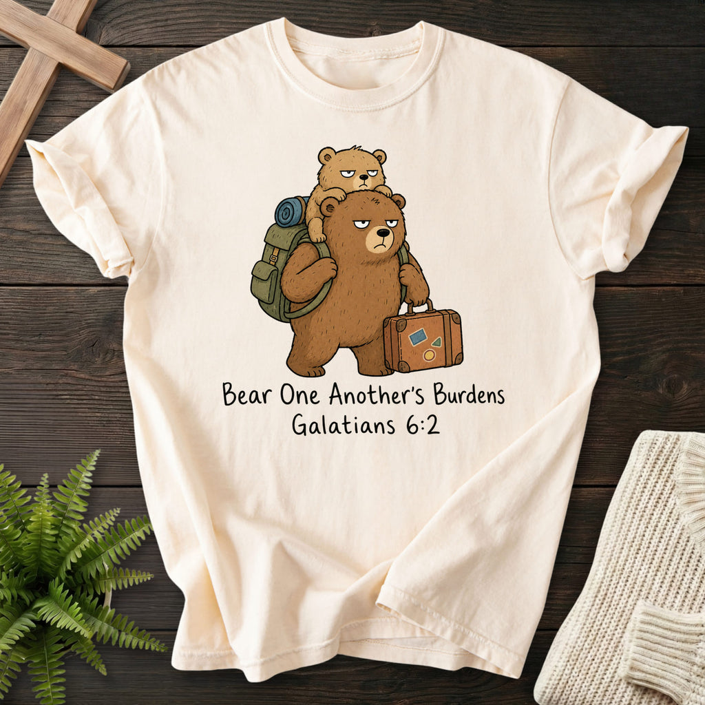 Flatlay of an Ivory Christian t-shirt for women with "Bear One Another's Burdens T-Shirt" Galatians 6:2 From Printify.