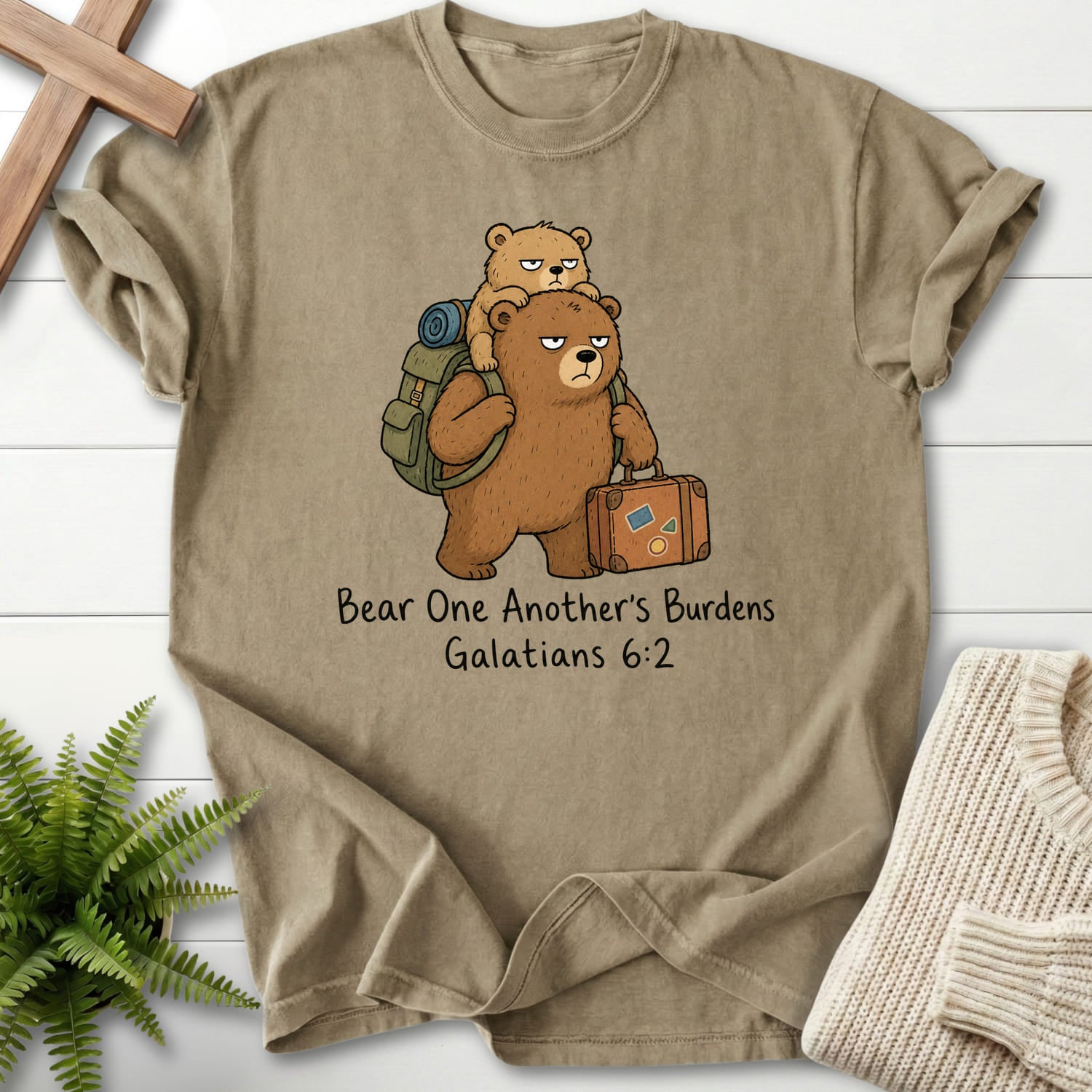 Khaki color option for the Bear One Anothers Burdens faith-based tee with "Bear One Another's Burdens T-Shirt" Galatians 6:2.