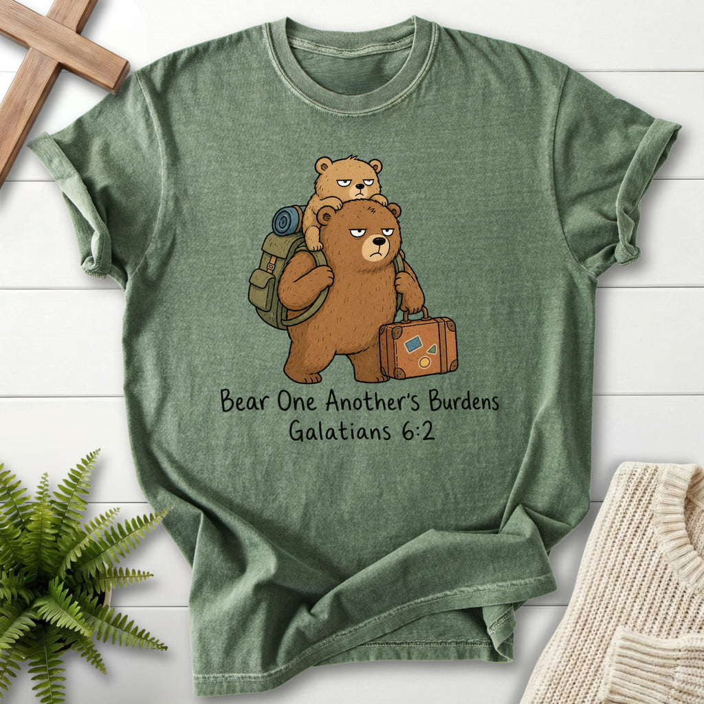 Flat lay of a Moss Comfort Colors 1717 Scripture shirt featuring "Bear One Another's Burdens T-Shirt" Galatians 6:2.