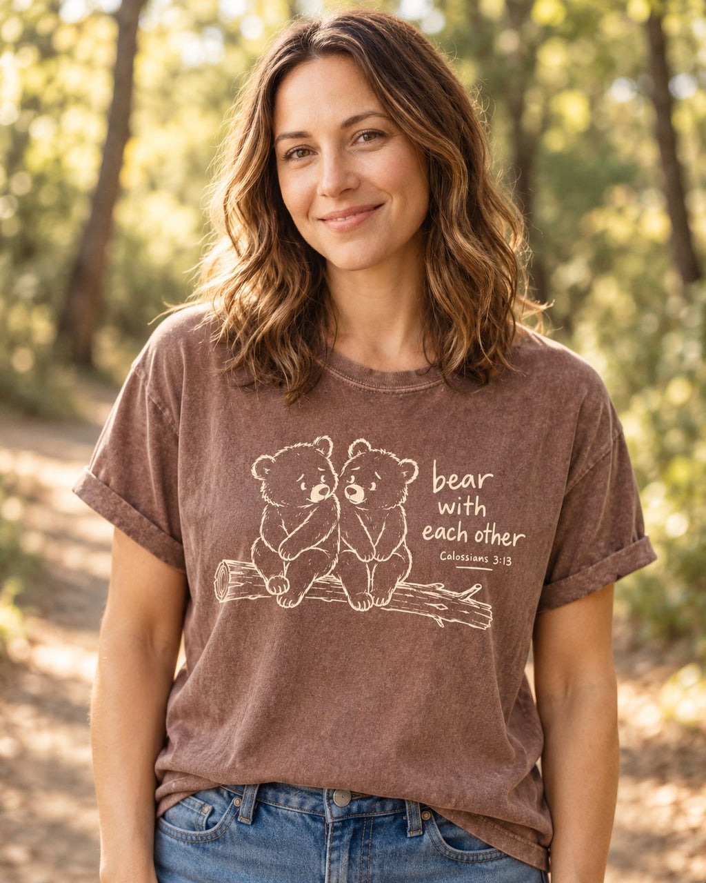 Bear with Each Other, Espresso women's Christian tee, lifestyle photo in nature trail, two bear cubs on a log with bear with each other, She Wears Faith