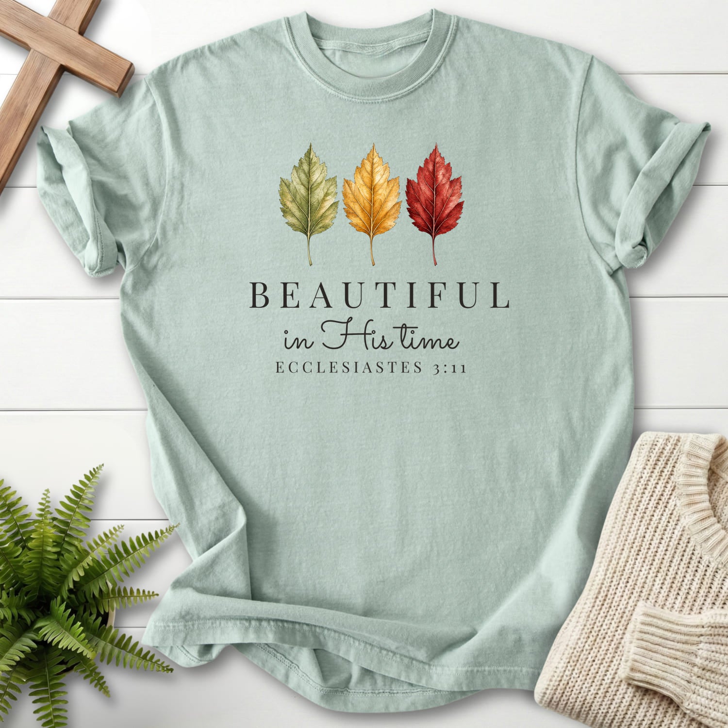 Flat lay of a Bay women's Christian tee featuring "Beautiful in His Time T-Shirt" Ecclesiastes 3:11.