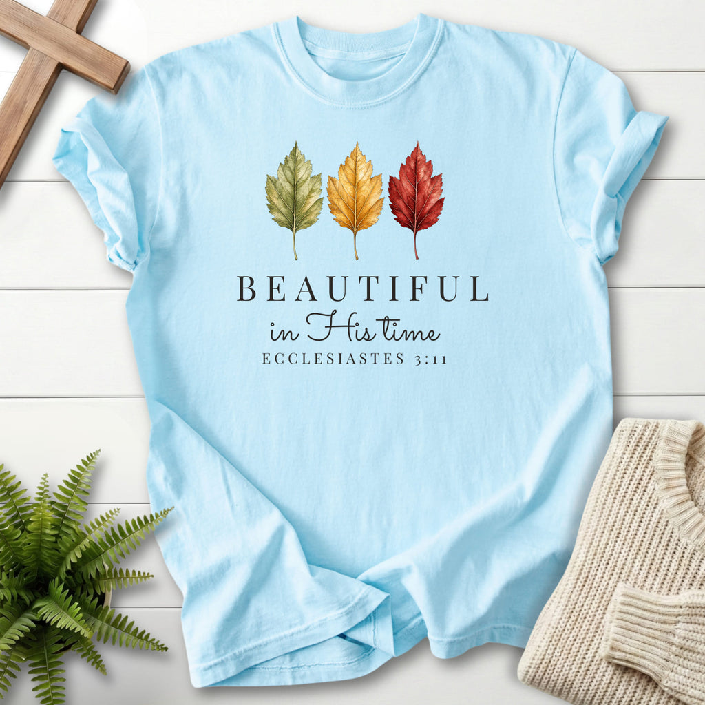 Flat lay of a Chambray Comfort Colors 1717 Christian t-shirt for women featuring "Beautiful in His Time T-Shirt" Ecclesiastes 3:11 From Printify.