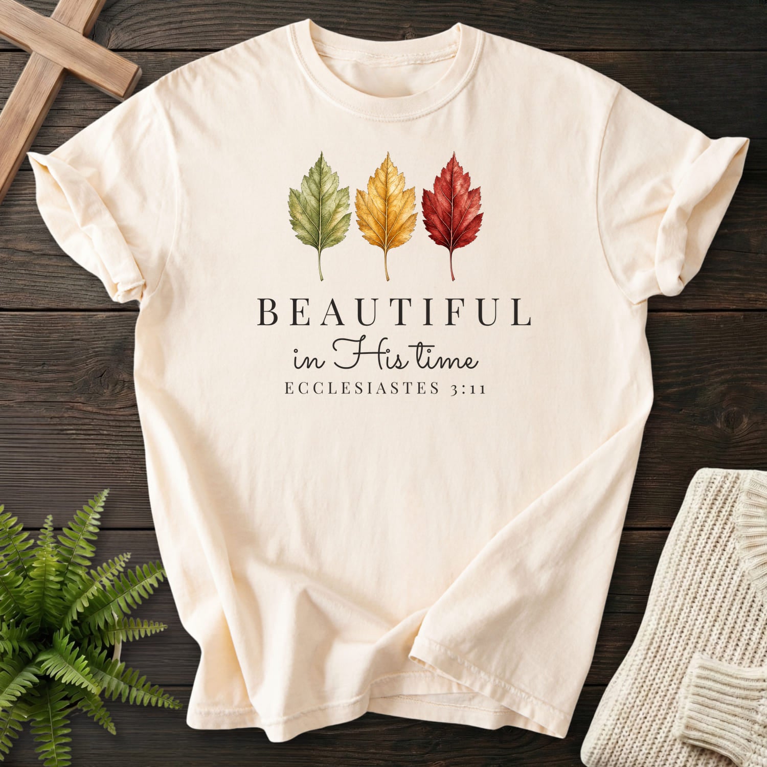 Flatlay of an Ivory faith-based tee with "Beautiful in His Time T-Shirt" Ecclesiastes 3:11.