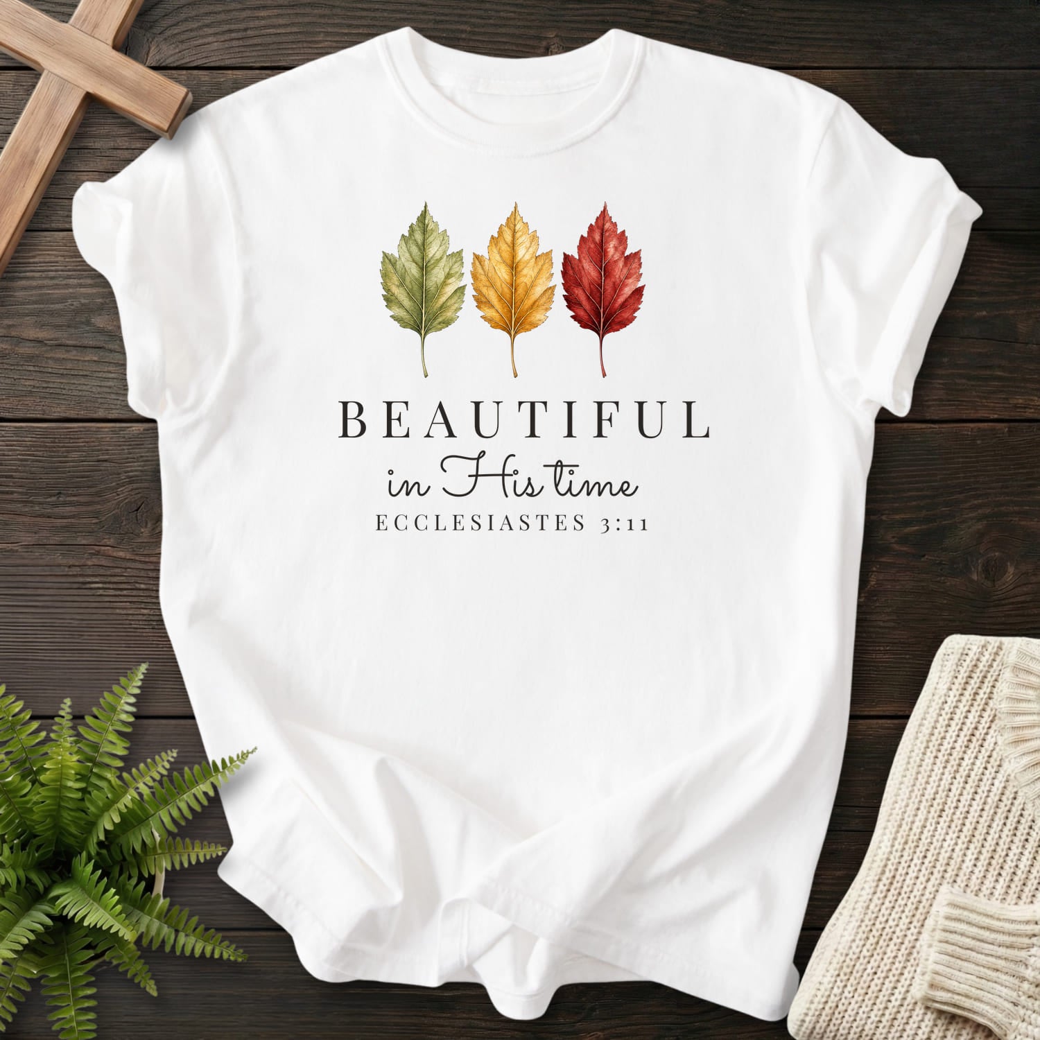 Flat lay of a White Bible verse tee featuring "Beautiful in His Time T-Shirt" Ecclesiastes 3:11.