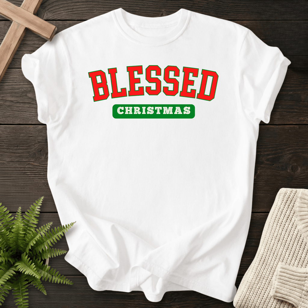 White Christian t-shirt for women with bold collegiate red and green holiday lettering and 'Blessed Christmas'.