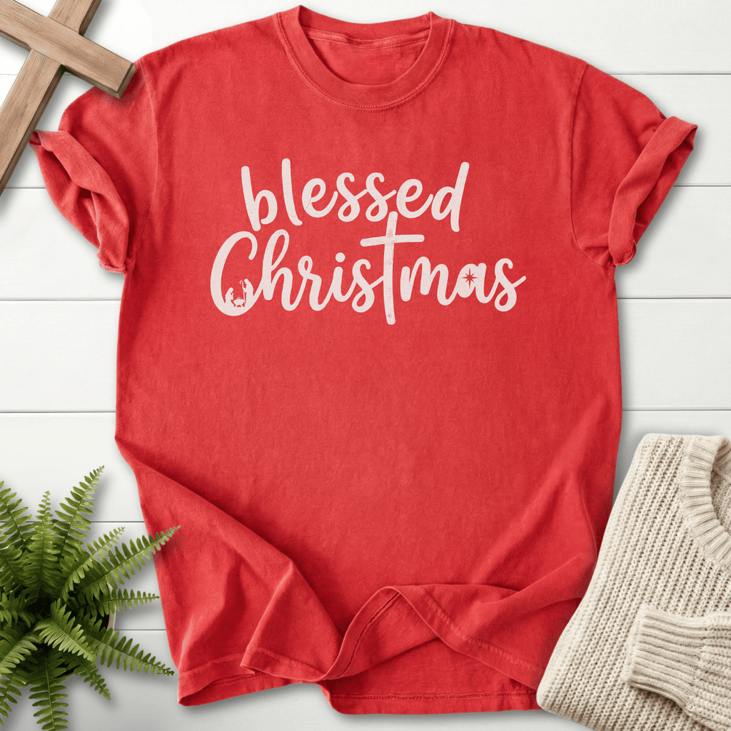 Red Christian t-shirt for women with handwritten 'blessed Christmas' script and a cross-styled T design.