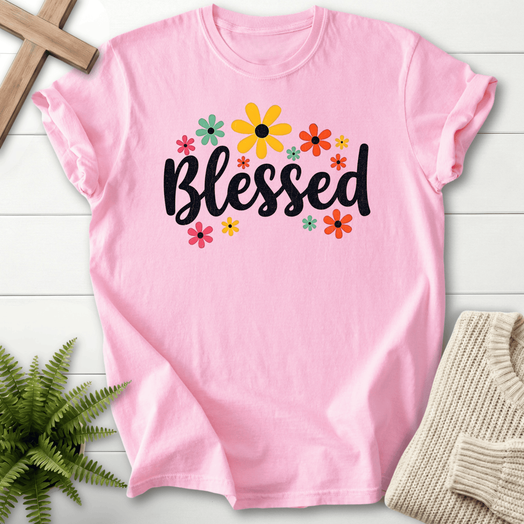 Blossom Christian t-shirt for women with bold black 'Blessed' script and a colorful retro floral arrangement.
