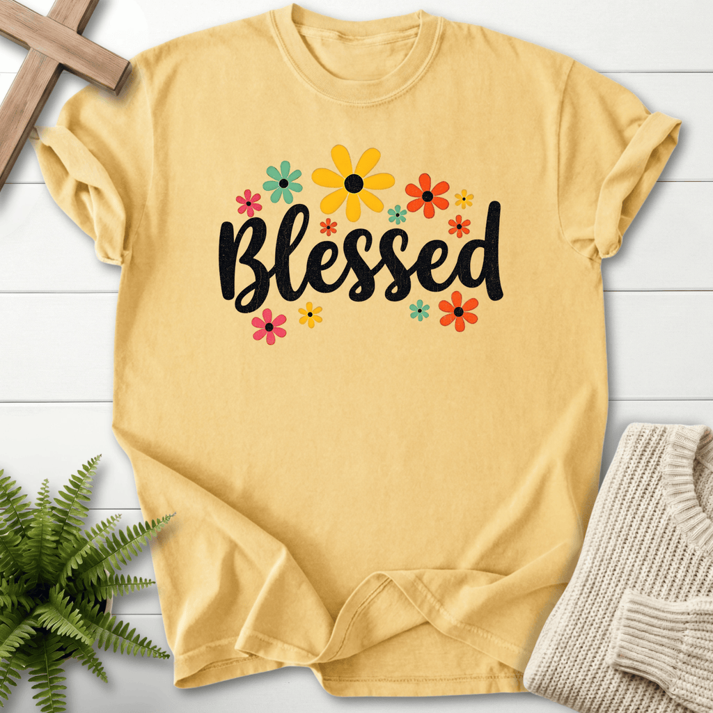 Butter yellow Christian t-shirt for women with a retro floral design featuring pink, teal, and orange daisies.