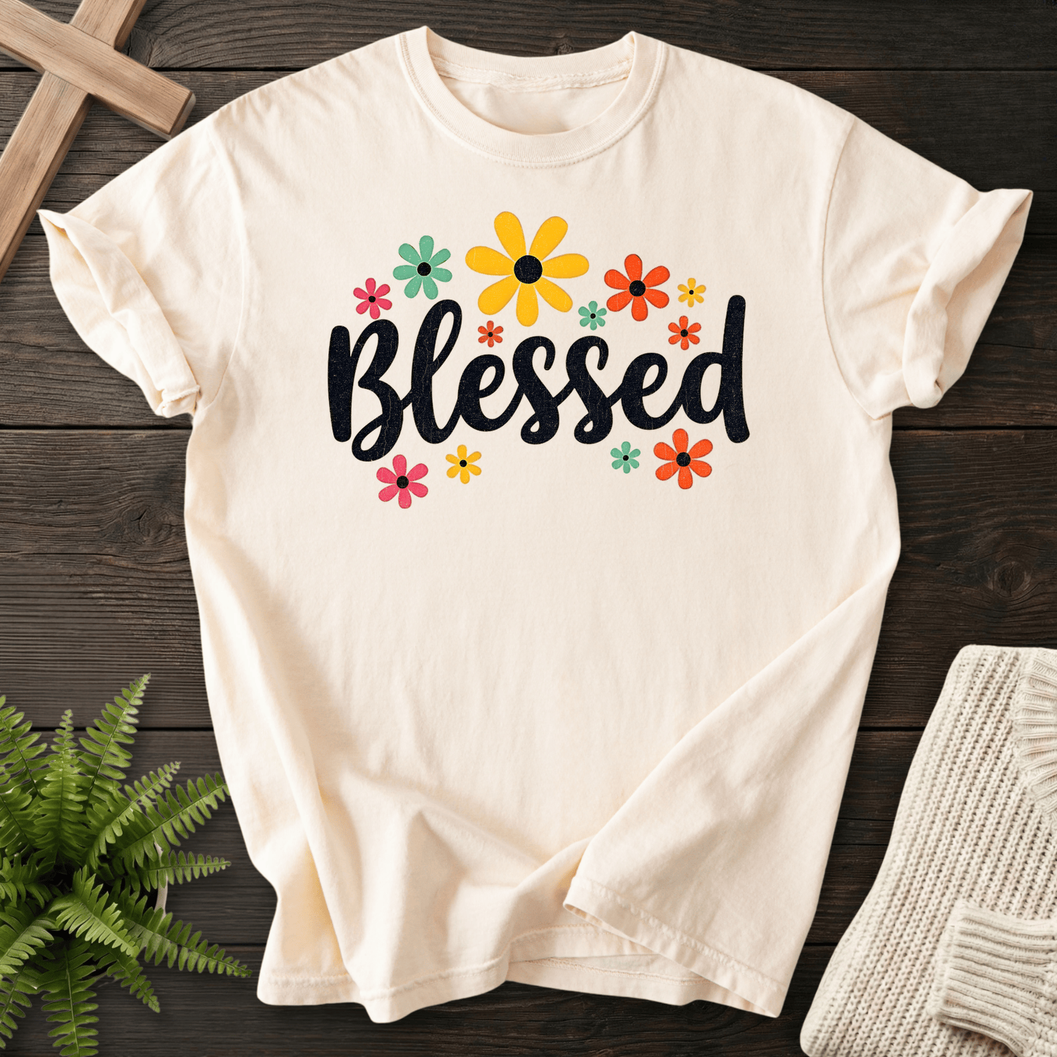 Ivory Christian t-shirt for women with a retro daisy and sunflower design around bold black script.