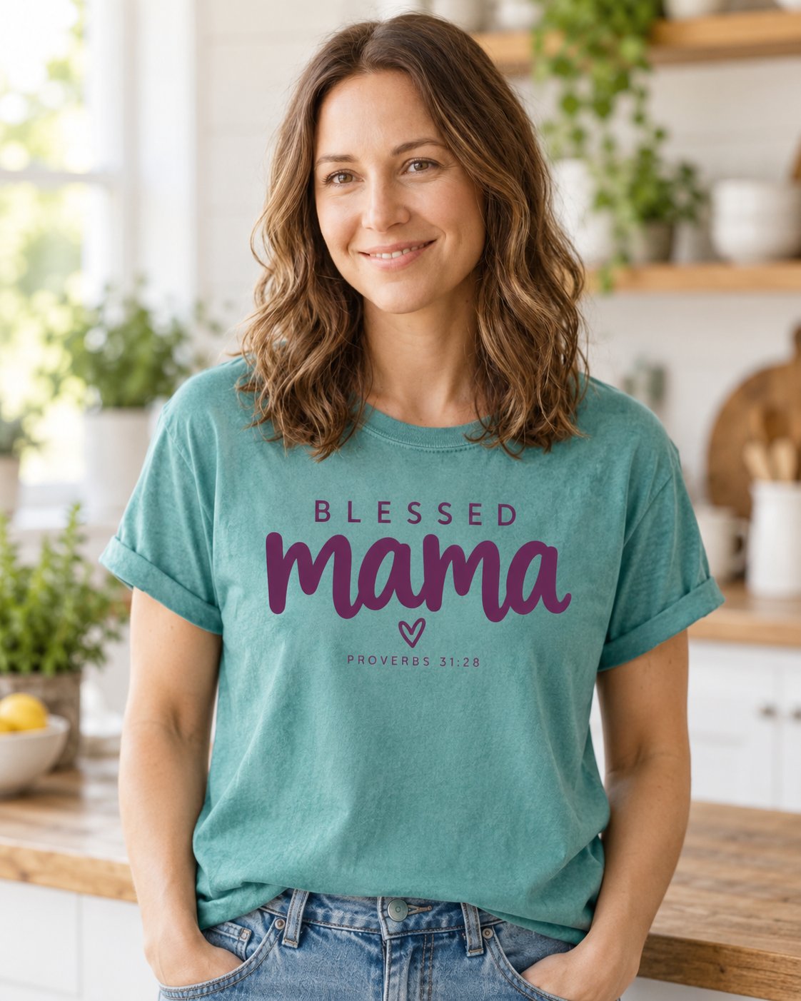 Blessed Mama Minimalist Heart, Chalky Mint women's Christian tee, lifestyle photo in morning kitchen setting, Minimalist BLESSED mama script lettering with a small heart, She Wears Faith