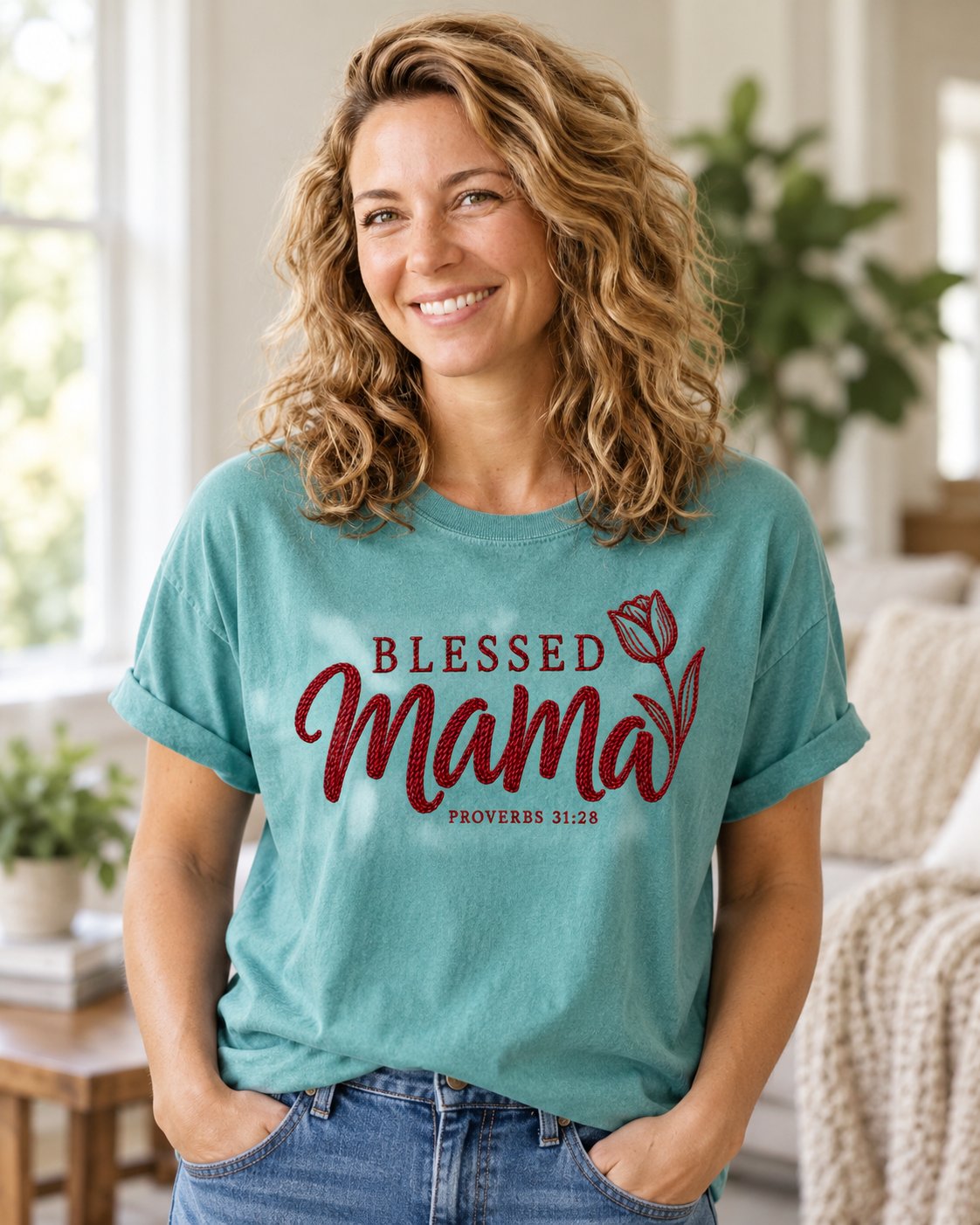 Blessed Mama Tulip, Chalky Mint women's Christian tee, lifestyle photo in cozy living room, BLESSED Mama script lettering with a tulip, She Wears Faith