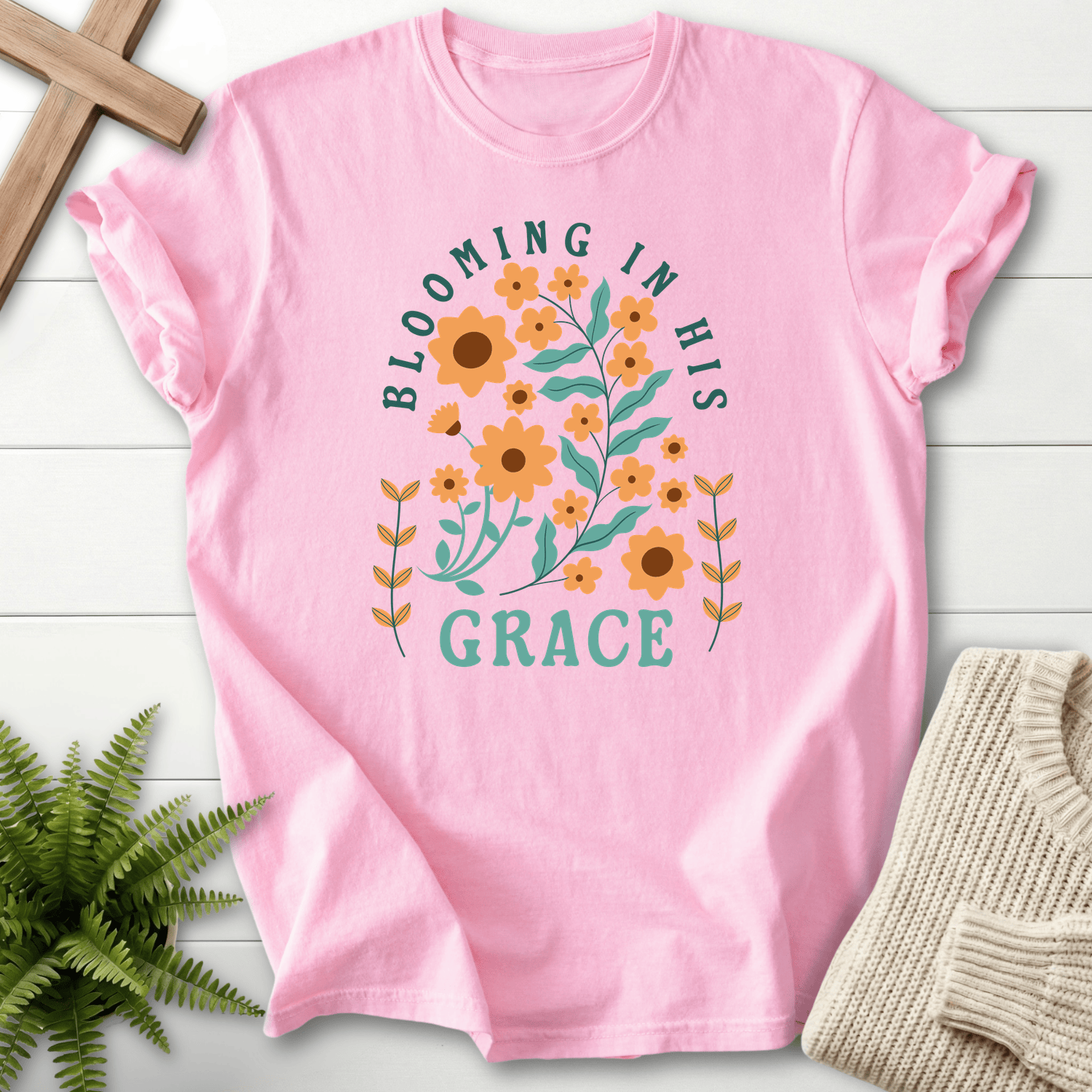 Blossom Christian t-shirt for women with a retro botanical flower and leaf arch graphic.
