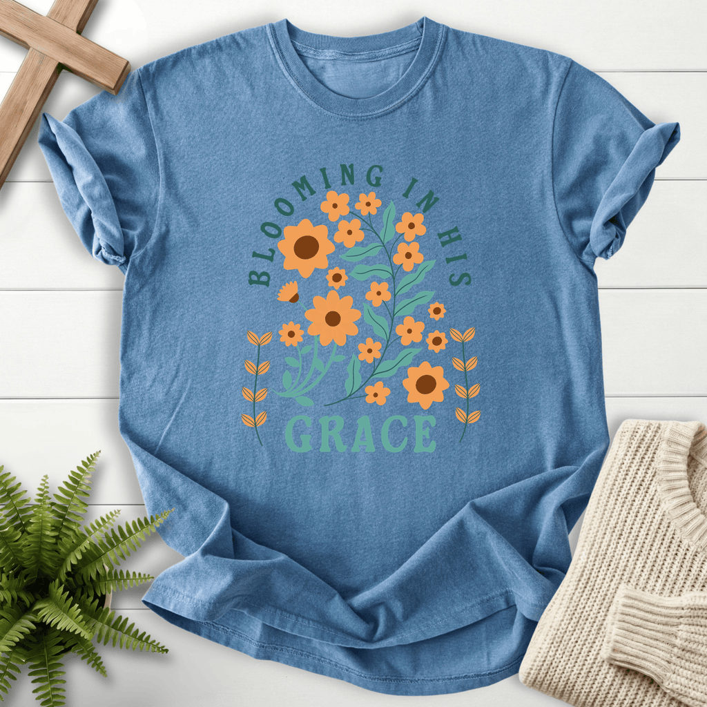 Blue Jean Christian t-shirt for women with orange botanical artwork and teal lettering.