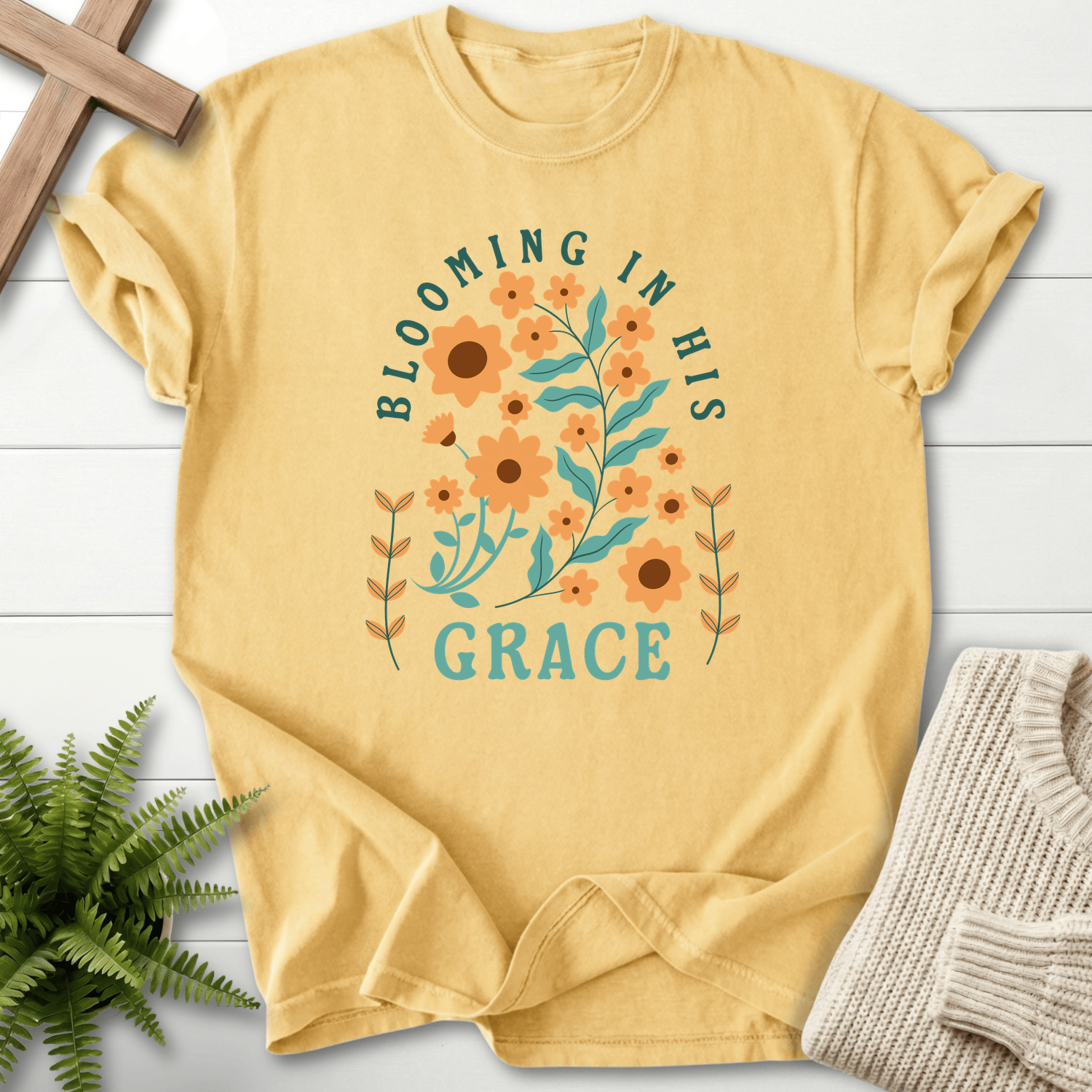 Butter yellow Christian t-shirt for women with orange sunflower and teal Grace design.